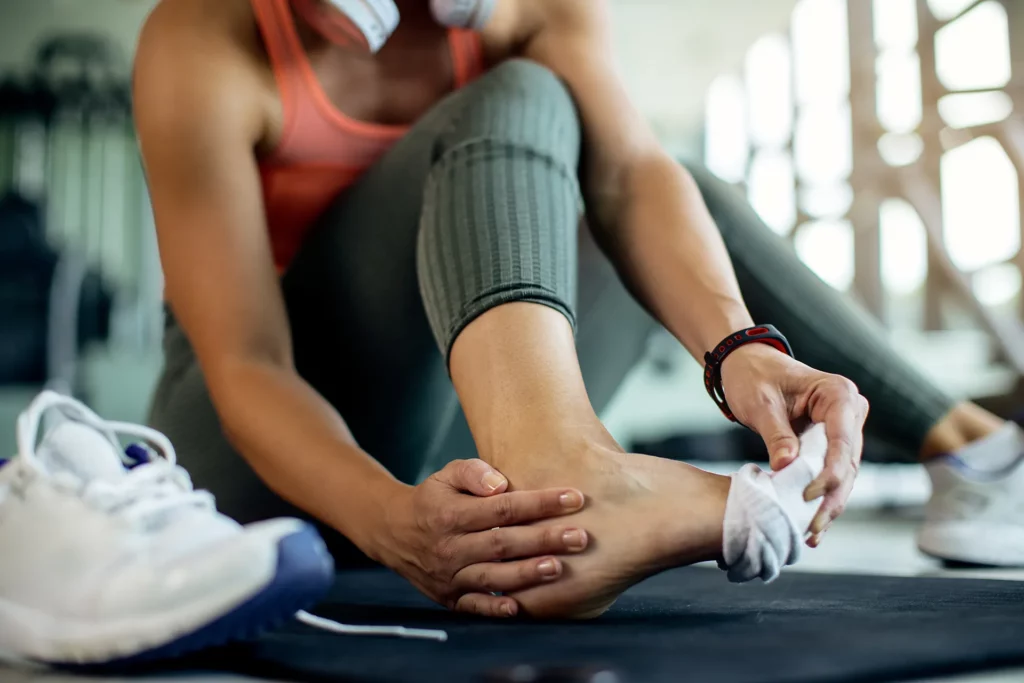 Copy of close up of athletic woman injured her foot during 2023 11 27 05 25 09 utc