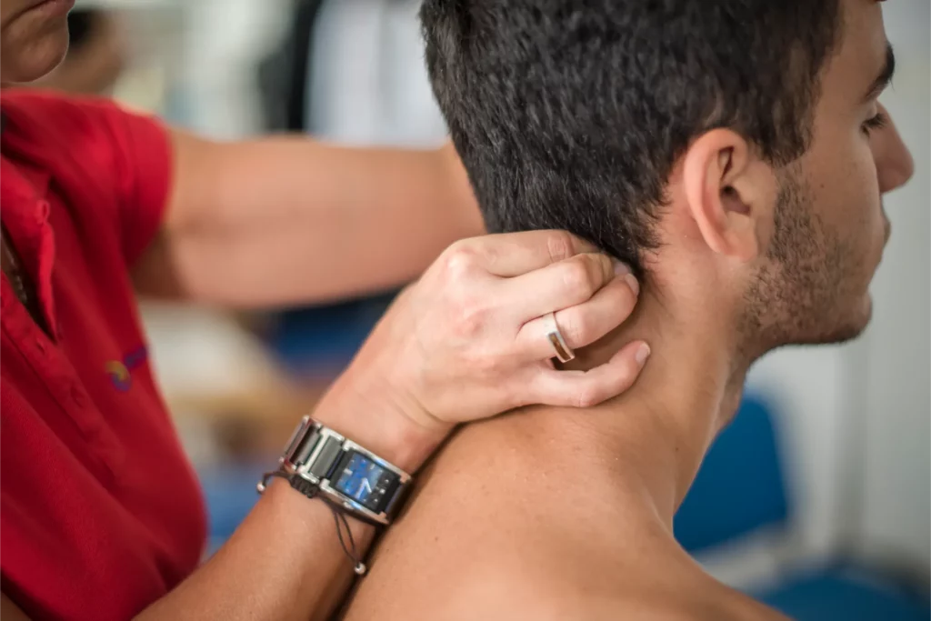 physiotherapist visits a young sportsman who feels 2023 11 27 05 24 38 utc